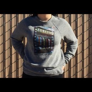 Gray crew neck with a surf shop picture